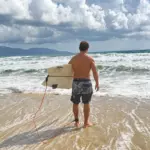 Surfer checking waves in Da Nang