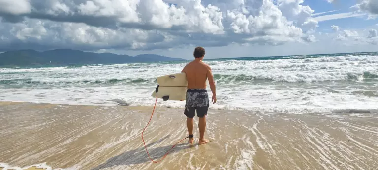 Surfer checking waves in Da Nang