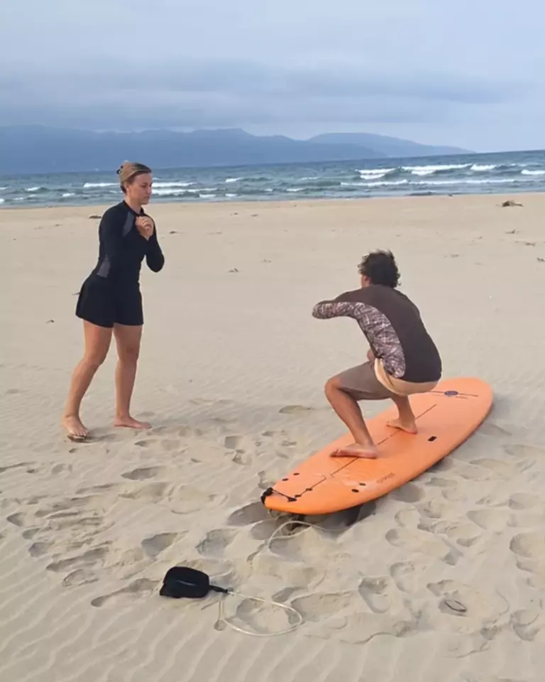 Preparing for a surf lesson on the beach in Da Nang