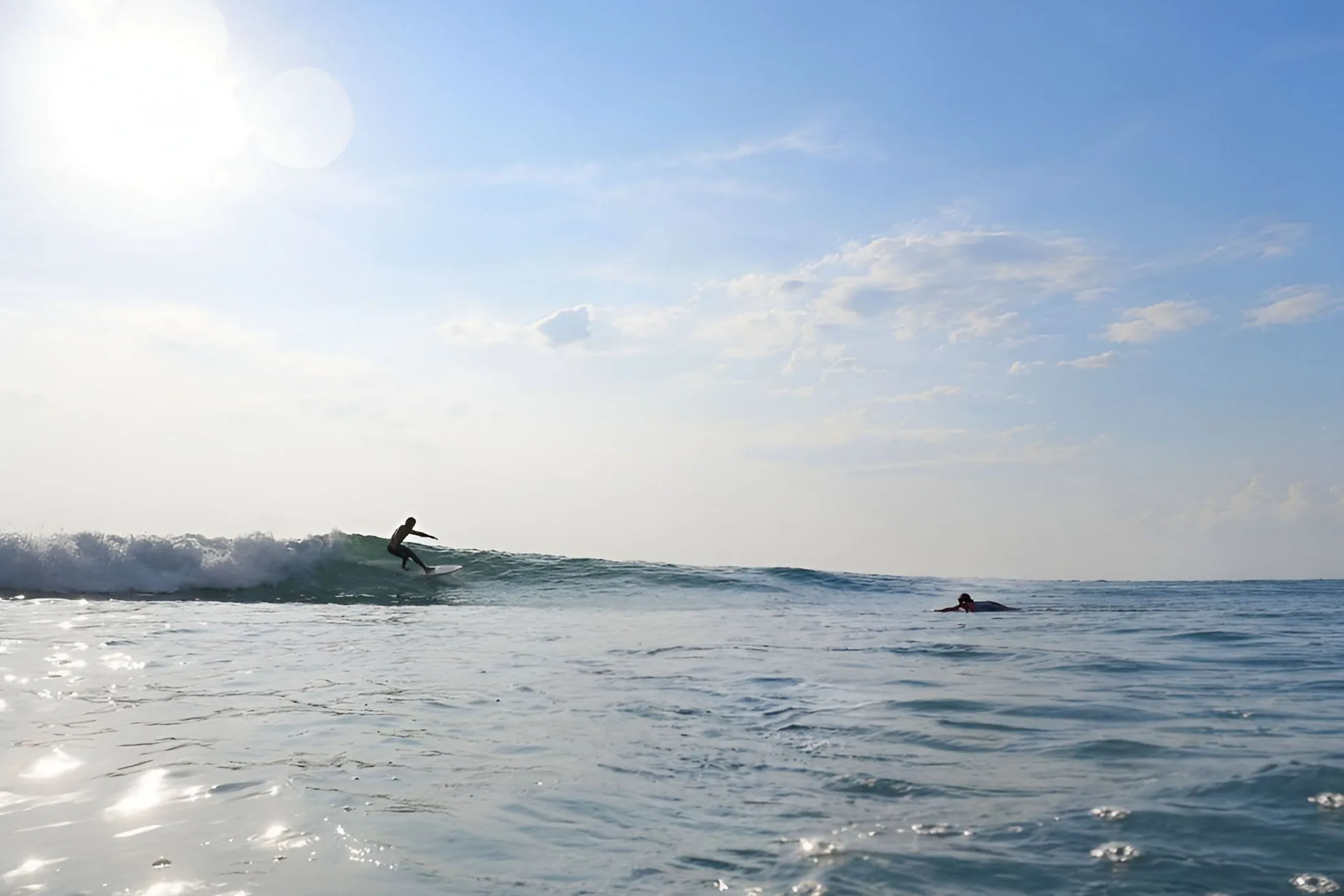 Surfer riding a wave in Da Nang, Vietnam